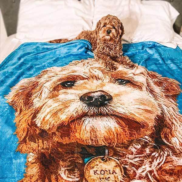 A fleece blanket with custom pet art print featuring a detailed image of a dog with a small dog figurine on top - Pop Your Pup